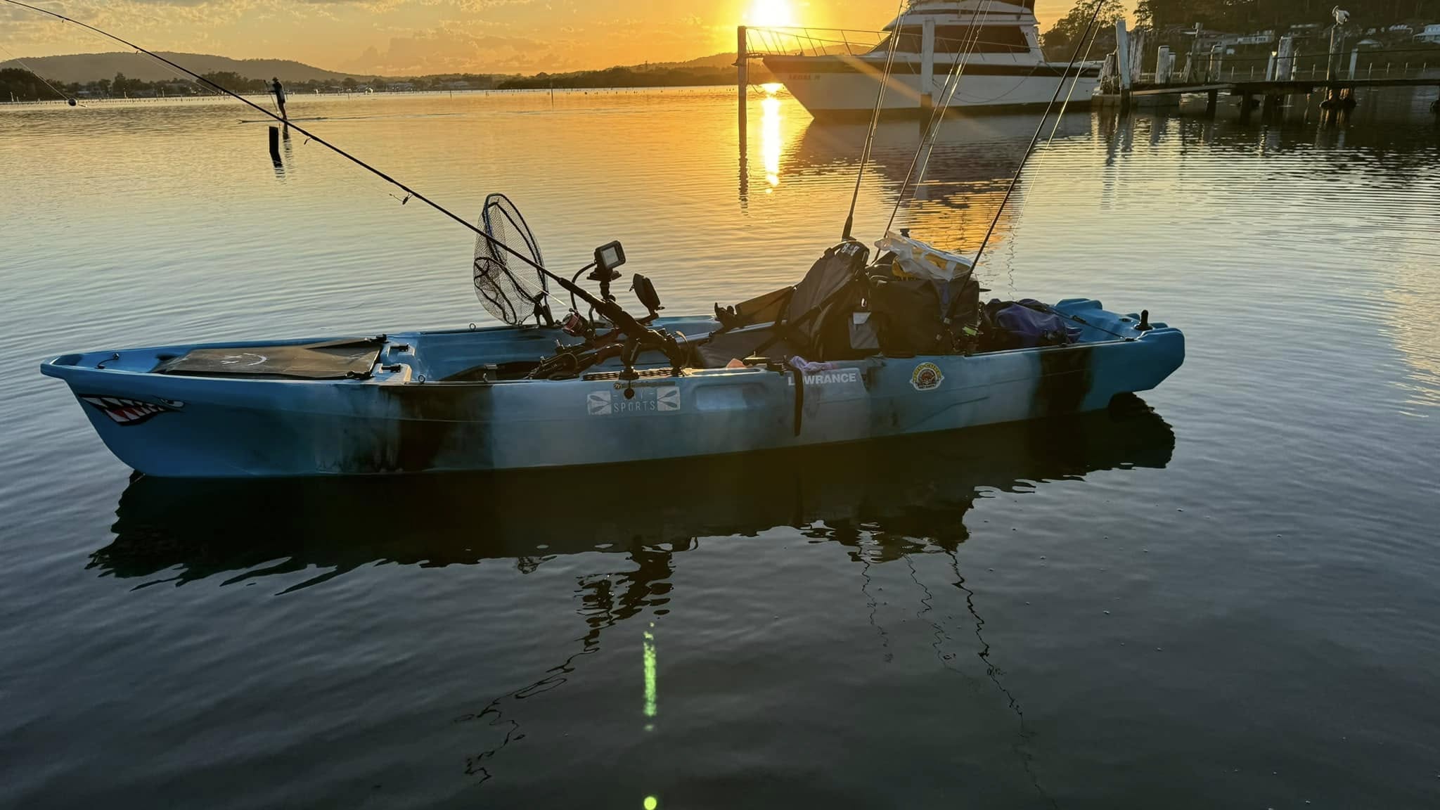 Paddling at sunrise on a Bay Sports kayak